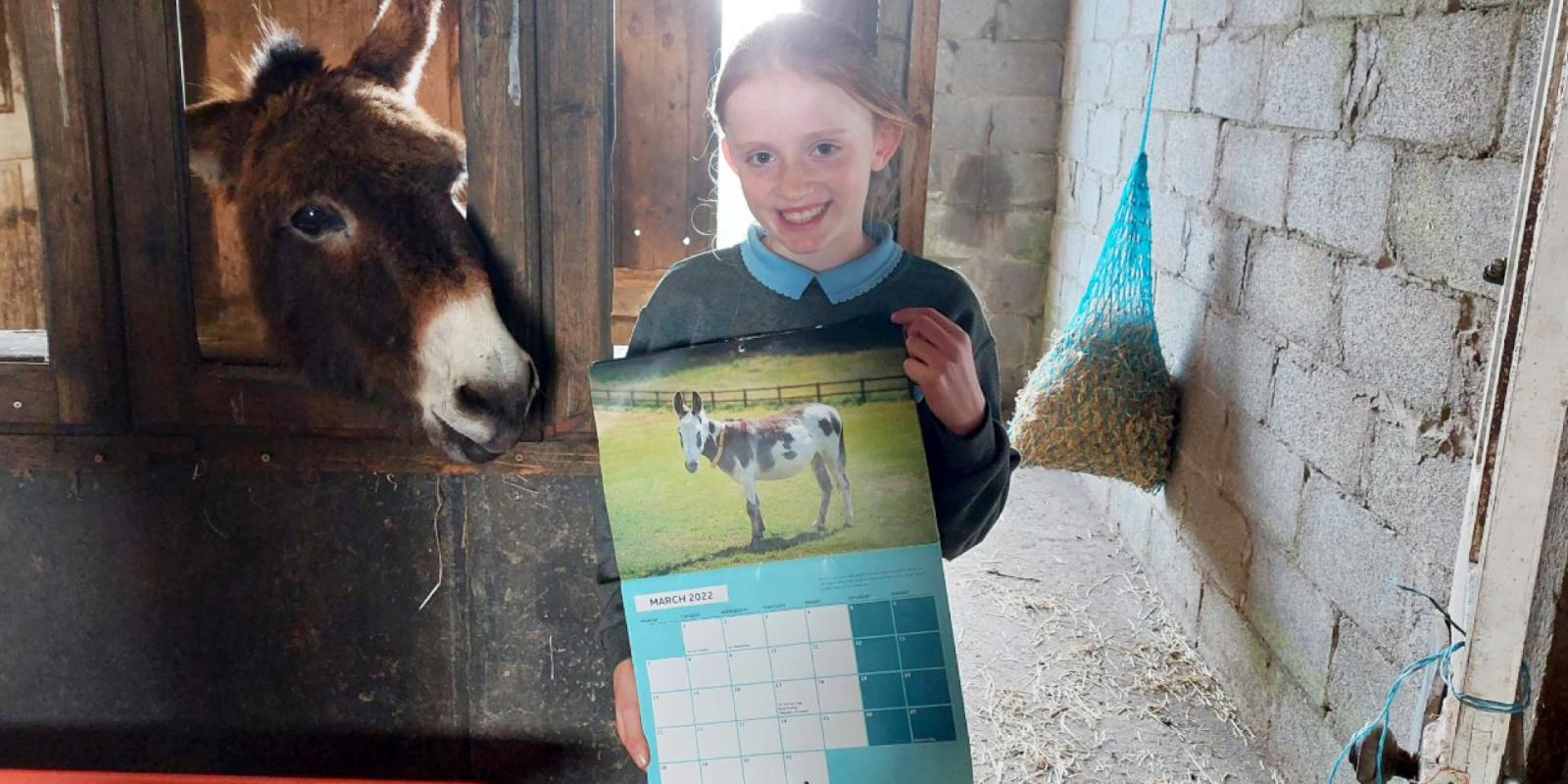 June in Sid and Sal's shed with her calendar